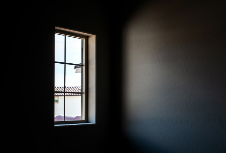 Dark room with window 